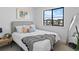 Cozy bedroom with a comfortable bed, stylish furnishings, and a large window providing plenty of natural light at 2078 S Holly St # 3, Denver, CO 80222