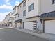 Modern townhomes showcasing sleek architectural design with private garages in a well-maintained community at 2078 S Holly St # 3, Denver, CO 80222