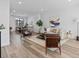 Bright living room featuring neutral walls, a patterned area rug and stylish furniture at 2078 S Holly St # 3, Denver, CO 80222