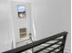 Bright staircase featuring high ceilings, modern railings, and large windows offering plenty of natural light at 2078 S Holly St # 3, Denver, CO 80222