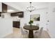 Cozy dining area featuring modern chandelier, dark cabinets and space for a round table at 1842 S Pitkin Cir # A, Aurora, CO 80017
