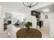 Inviting open living space featuring a fireplace, dining area, and kitchen with dark cabinets at 1842 S Pitkin Cir # A, Aurora, CO 80017