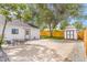 A spacious backyard offers an area for dining and an outbuilding for extra storage at 3452 S Clay St, Englewood, CO 80110