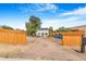 Large backyard featuring a detached garage and wooden fence at 3452 S Clay St, Englewood, CO 80110