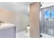 Modern bathroom with a sleek vanity, glass-enclosed shower, and updated fixtures at 3452 S Clay St, Englewood, CO 80110