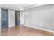 Spacious bedroom with hardwood floors and neutral paint, offering a clean and versatile space at 3452 S Clay St, Englewood, CO 80110