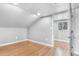 Bright bedroom featuring wood-look floors and neutral walls at 3452 S Clay St, Englewood, CO 80110