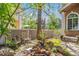 Tranquil backyard with seating, mature trees, and lovely landscaping at 2364 S Harlan St, Lakewood, CO 80227
