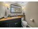 Cozy bathroom with rustic wood countertops, modern fixtures, and stylish decor at 2364 S Harlan St, Lakewood, CO 80227