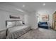 Bedroom with gray carpet and comfortable blue couch in a naturally lit reading nook at 2364 S Harlan St, Lakewood, CO 80227