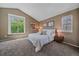 Inviting bedroom with neutral walls, natural light, and comfortable furnishings at 2364 S Harlan St, Lakewood, CO 80227