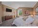 Bedroom with high ceilings, built-in storage, and large window at 2364 S Harlan St, Lakewood, CO 80227