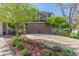 Beautiful two-story home featuring a spacious driveway and lush landscaping at 2364 S Harlan St, Lakewood, CO 80227
