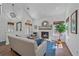Comfortable living room with fireplace, hardwood floors and large windows at 2364 S Harlan St, Lakewood, CO 80227