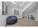 Open loft area featuring skylights, a unique railing, and comfortable seating at 2364 S Harlan St, Lakewood, CO 80227