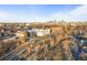 Expansive aerial view showcasing Denver's skyline, residential areas and urban landscape at 1047 Meade St, Denver, CO 80204