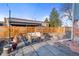 Inviting backyard with patio furniture, lush rug, and string lighting for a relaxing ambiance at 1047 Meade St, Denver, CO 80204