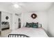 Cozy bedroom with a mirrored closet, modern lighting, and comfortable furnishings at 1293 S Perry St, Denver, CO 80219