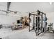 Spacious garage featuring workout equipment and ample space for parking and storage at 1293 S Perry St, Denver, CO 80219