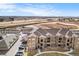 Beautiful aerial view of the apartment complex and surrounding community with easy access to the highway at 17297 Wilde Ave # 205, Parker, CO 80134