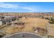 Wonderful aerial perspective of the community park, playground, walking paths, and convenient neighborhood street at 17297 Wilde Ave # 205, Parker, CO 80134