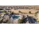 Great aerial view of the community pool, clubhouse, park, and walking trails perfect for an active lifestyle at 17297 Wilde Ave # 205, Parker, CO 80134