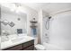 Bathroom featuring a single sink vanity, a shower/tub combo and modern decor at 17297 Wilde Ave # 205, Parker, CO 80134