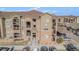 Beautiful condo building with stone accents, private balconies, and well-maintained landscaping at 17297 Wilde Ave # 205, Parker, CO 80134