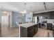 Modern kitchen featuring an island, stainless steel appliances, and pendant lighting at 17297 Wilde Ave # 205, Parker, CO 80134