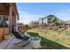 Beautiful backyard with a patio and relaxing lounge chairs at 7251 S Old Hammer Way, Aurora, CO 80016