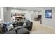 Spacious basement featuring a cozy sitting area and rec space with custom shelving and fun pirate decorations at 7251 S Old Hammer Way, Aurora, CO 80016
