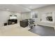 Finished basement rec room with an entertainment center, electric fireplace, and an exercise area with weights at 7251 S Old Hammer Way, Aurora, CO 80016