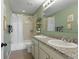 Full bathroom featuring a dual sink vanity, tub with shower, and neutral earth tone colors at 7251 S Old Hammer Way, Aurora, CO 80016