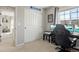 Bedroom featuring a gaming setup, Aviation Blvd sign, and double door closet at 7251 S Old Hammer Way, Aurora, CO 80016