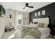 Bright bedroom with large bed, modern decor, and plenty of natural light at 7251 S Old Hammer Way, Aurora, CO 80016