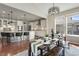 Bright dining area with views of the kitchen and natural light at 7251 S Old Hammer Way, Aurora, CO 80016