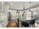 Bright, open kitchen featuring an island, stainless appliances, and updated cabinets at 7251 S Old Hammer Way, Aurora, CO 80016