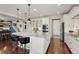 Modern kitchen with stainless appliances and granite counters and an island with seating at 7251 S Old Hammer Way, Aurora, CO 80016