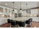 Spacious kitchen features an island with bar seating and stainless steel appliances at 7251 S Old Hammer Way, Aurora, CO 80016