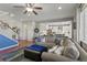 Spacious living room with a comfortable couch, hardwood floors, and an open floor plan at 7251 S Old Hammer Way, Aurora, CO 80016