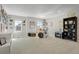 Spacious living room with drumset, guitars, and decorative wall art at 7251 S Old Hammer Way, Aurora, CO 80016