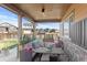 Cozy covered porch with a seating area, perfect for outdoor relaxation at 7251 S Old Hammer Way, Aurora, CO 80016