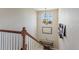 Stairway landing features a large window and decorative artwork at 7251 S Old Hammer Way, Aurora, CO 80016