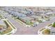 Neighborhood street showcasing well-maintained homes with sidewalks and manicured lawns at 15484 E 115Th Ave, Commerce City, CO 80022