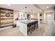 Finished basement featuring a stylish bar area, ample seating, and modern flooring at 15484 E 115Th Ave, Commerce City, CO 80022