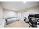 Cozy bedroom with a workspace, perfect for a home office or gaming setup at 15484 E 115Th Ave, Commerce City, CO 80022