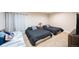 Bedroom with two beds, neutral tones, and a cozy atmosphere at 15484 E 115Th Ave, Commerce City, CO 80022