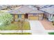 Charming single-story home featuring a stone facade and well-maintained front yard with mature trees at 15484 E 115Th Ave, Commerce City, CO 80022