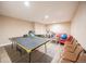 Spacious game room featuring ping pong table and seating, perfect for recreation and fun at 15484 E 115Th Ave, Commerce City, CO 80022