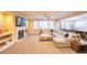 Inviting living space with a fireplace, large windows, and comfortable seating at 15484 E 115Th Ave, Commerce City, CO 80022